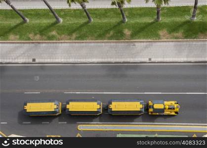 road train carrying tourists yellow
