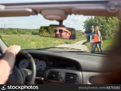road trip, hitchhike, travel, gesture and people concept - happy couple hitchhiking and stopping car at countryside