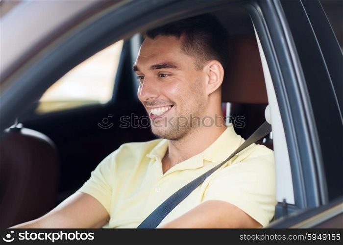 road trip, transport, leisure and people concept - happy smiling man driving car outdoors