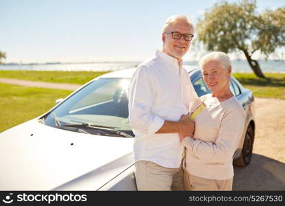 road trip, travel and old people concept - happy senior couple at car in summer. happy senior couple at car in summer