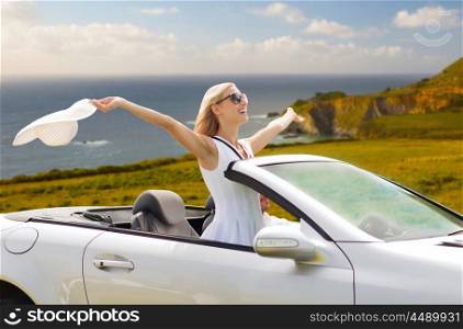 road trip, travel and people concept - happy couple driving in convertible car over big sur coast of california background. happy couple driving in convertible car. happy couple driving in convertible car