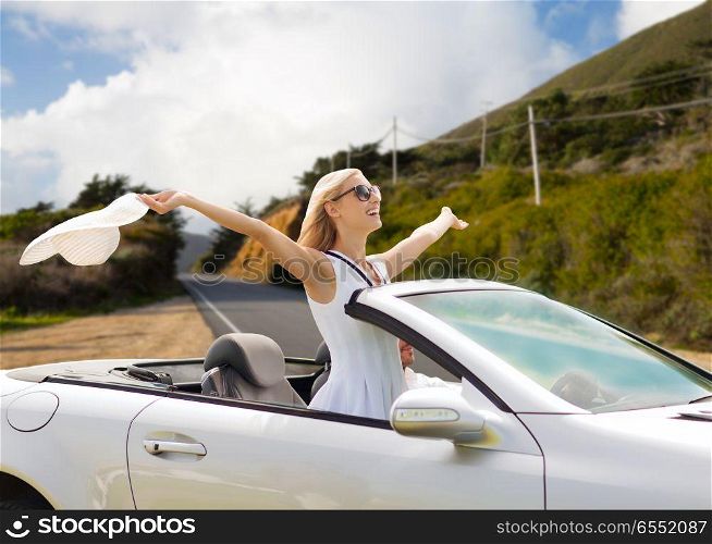 road trip, travel and people concept - happy couple driving in convertible car over big sur hills and road background in california. happy couple driving in convertible car. happy couple driving in convertible car