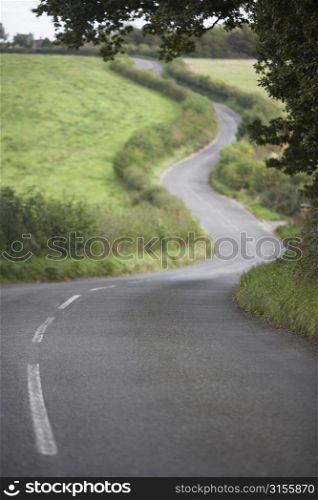 Road Winding Its Way Through The Countryside