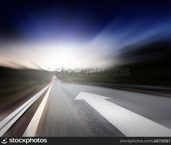 Road with arrow. Conceptual image of asphalt road and direction arrow