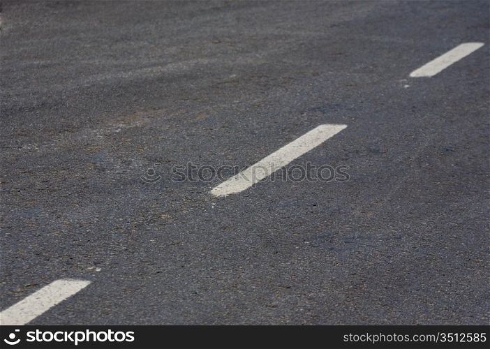 Road with white lines and asphalt texture