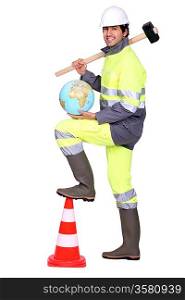 road worker holding a hammer on his shoulder and a globe