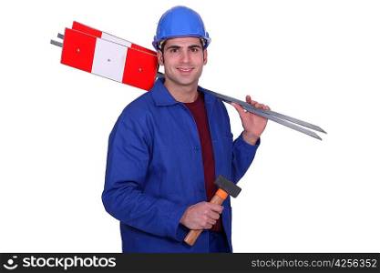 Road worker holding signs and hammer