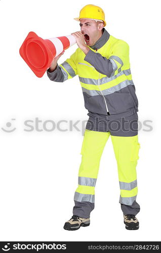 road worker shouting through a traffic cone