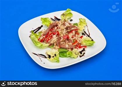 roast beef salad portion on white plate