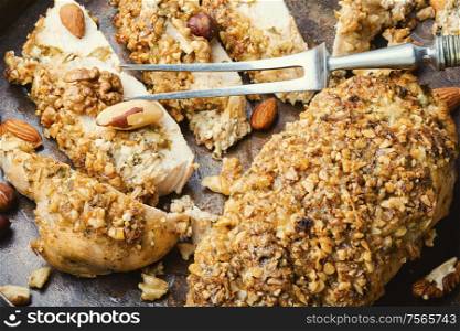 Roast chicken breast stuffed with walnuts and hazelnuts. Stuffed chicken breast with nuts.