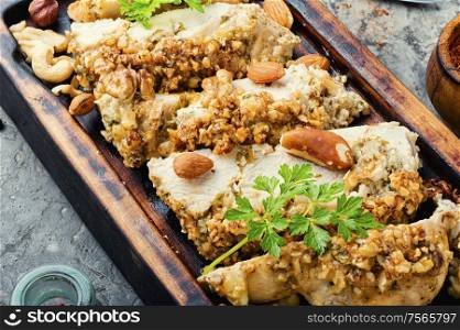 Roast chicken breast stuffed with walnuts and hazelnuts. Stuffed chicken breast with nuts.