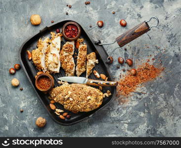 Roast chicken breast stuffed with walnuts and hazelnuts. Stuffed chicken breast with nuts.