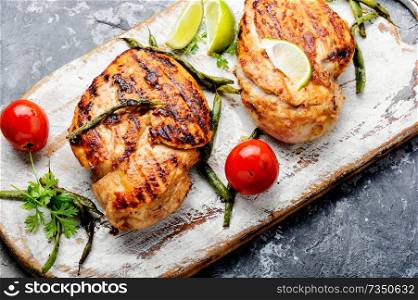 Roast chicken breast with vegetables.Grilled chicken breast. Whole chicken breast
