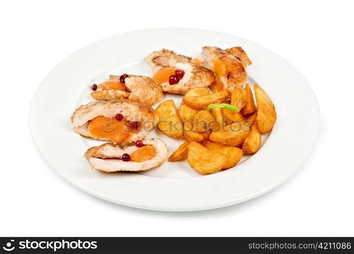 Roast chicken meat with apricot and potato closeup