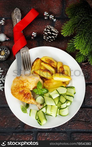 Roast chicken on a plate. Christmas background