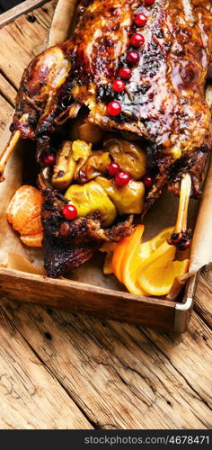 roast duck and oranges. Appetizing roasted duck with oranges cooked to a rustic recipe