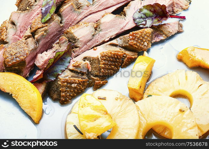 Roast duck fillet with spices.Baked delicious duck breast with pineapple sauce. Roasted duck with pineapple