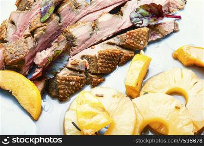 Roast duck fillet with spices.Baked delicious duck breast with pineapple sauce. Roasted duck with pineapple