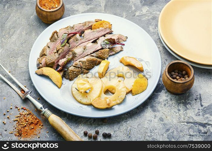 Roast duck fillet with spices.Baked duck breast with pineapple sauce. Roasted duck with pineapple