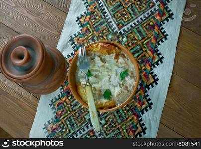 Roast Hutsul. Carpathian dish with meat, mushrooms and cream sauce