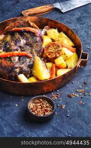 Roast lamb in the pan. Mutton meat cooked in pan with potatoes and pepper