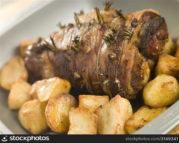 Roast Leg of Lamb Studded with Garlic and Rosemary and Roast Potatoes