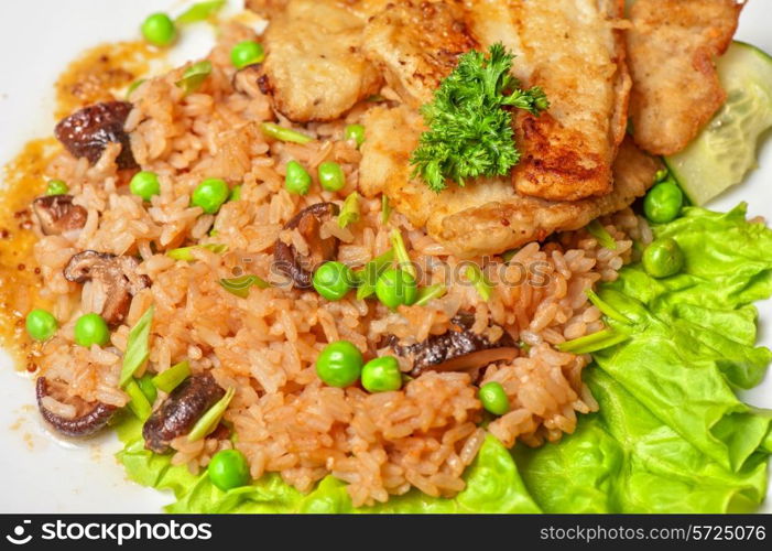 Roast pork and rice with vegetables and mushrooms