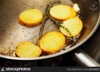 roast potatoes in a pan with spices