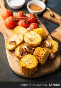 Roast vegetables on the wooden cutting board