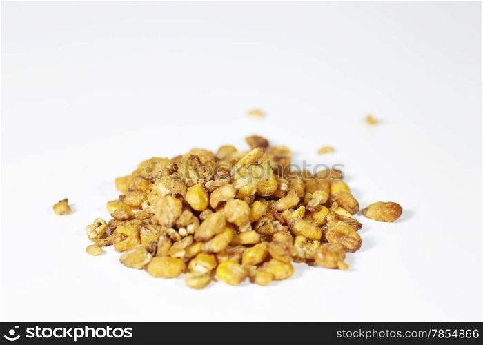 Roasted and crunchy corn on white background