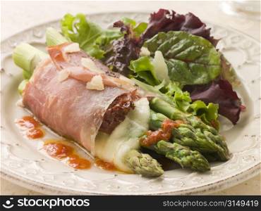 Roasted Asparagus spears with Mozzarella Cheese and Sun Dried Tomatoes wrapped in Prosciutto