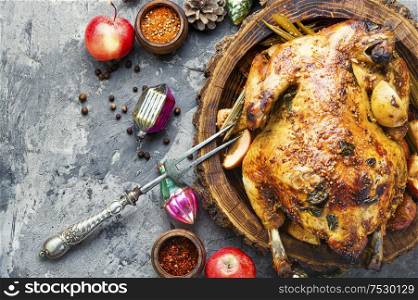 Roasted baked chicken stuffed with apples for Christmas table.Christmas food. Christmas meat food