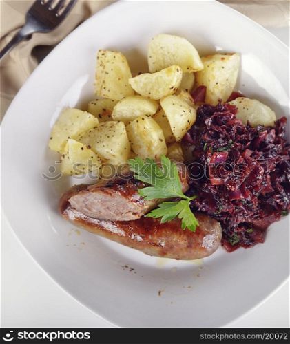 Roasted Bratwurst with Sweet and Sour Red Cabbage and Potatoes