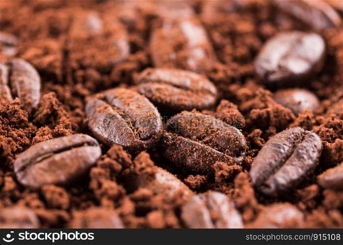 roasted brown coffee beans and powder background