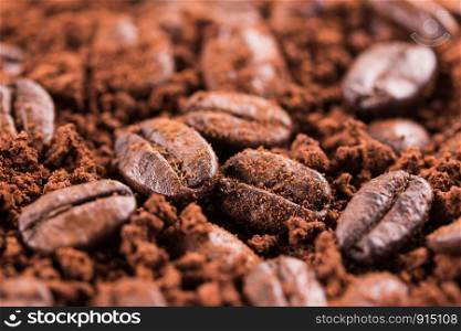 roasted brown coffee beans and powder background