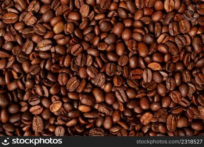 Roasted brown coffee beans, top view background. Coffee beans, top view background