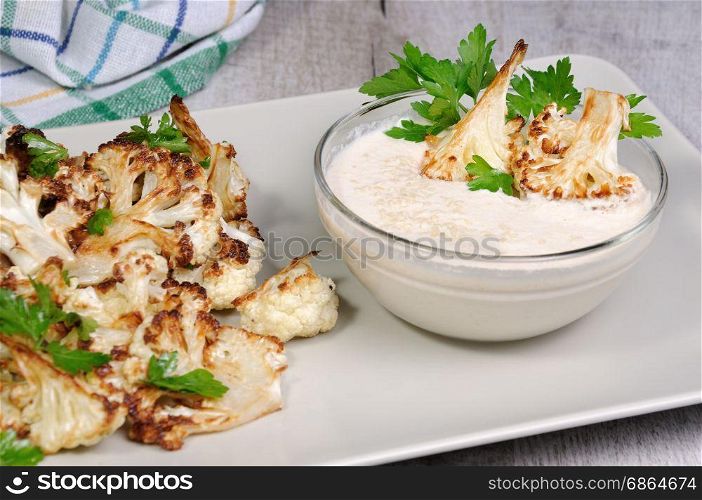 Roasted cauliflower with tahini sauce (sesame paste)