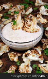 Roasted cauliflower with tahini sauce (sesame paste)