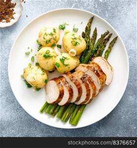 Roasted chicken breast, boiled new potato and grilled asparagus