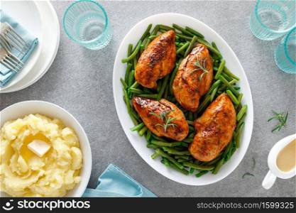 Roasted chicken breast with green beans, boiled mashed potatoes and gravy