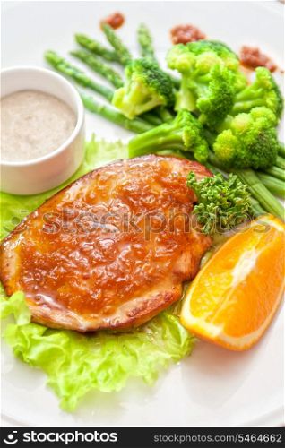 roasted chicken breast with vegetables and sauce