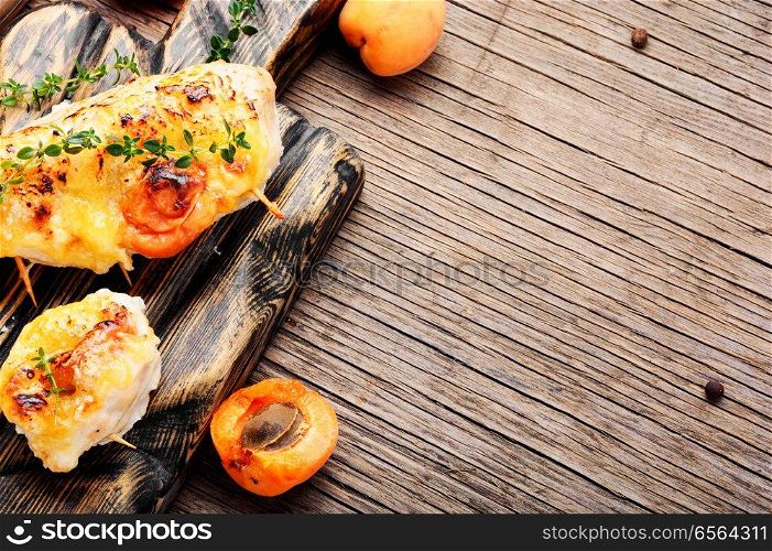 Roasted chicken breasts stuffed with apricot.Healthy food. Grilled chicken with apricot