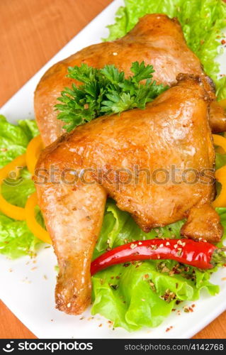 roasted chicken ham garnished with fresh green salad, pepper and greens