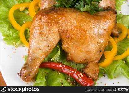roasted chicken ham garnished with fresh green salad, pepper and greens