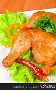 roasted chicken ham garnished with fresh green salad, pepper and greens