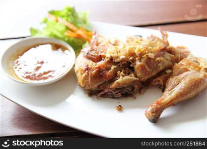 roasted chicken in wood background
