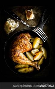 roasted chicken leg with potatoes