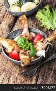 Roasted chicken legs. Grilled chicken legs with spicy and vegetables.Rustic food