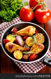 roasted chicken legs with vegetable and herbs