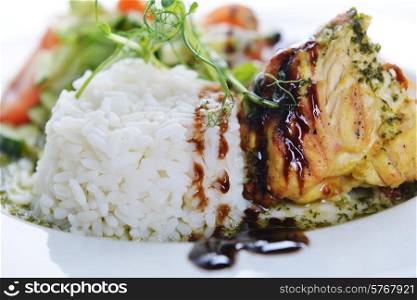 roasted chicken, rice and vegetables on dish